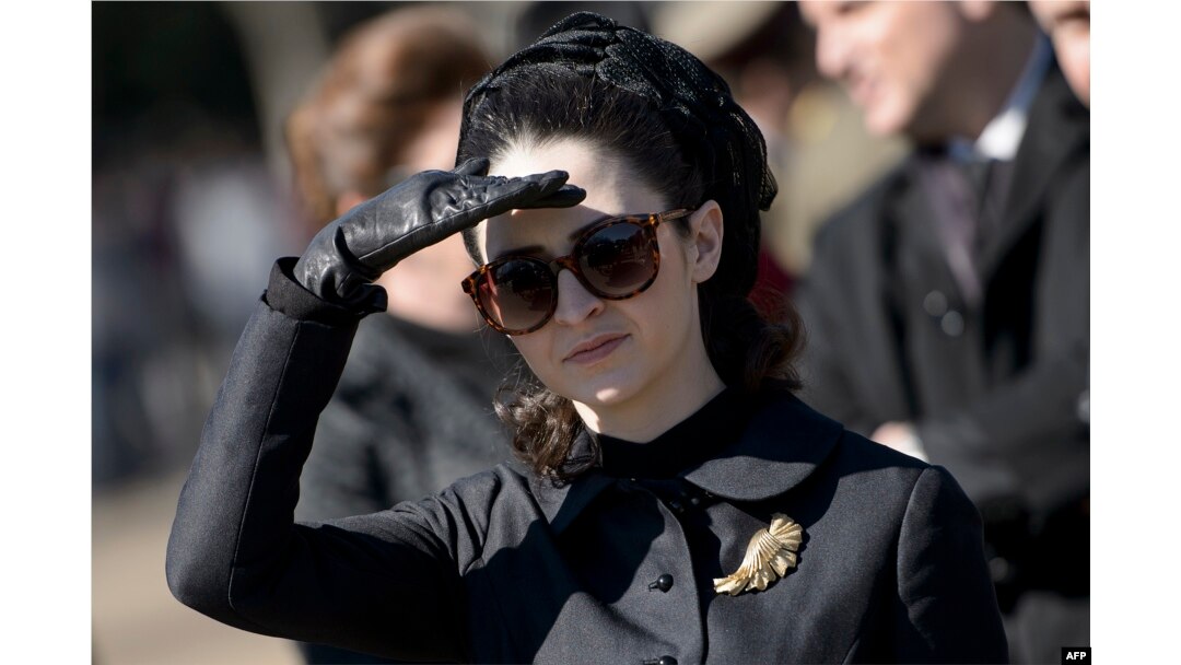 FILE - Actress Natalie Portman, in the role of Jacqueline Kennedy, is seen outside the White House while filming a scene for the movie "Jackie" on Pennsylvania Avenue February 28, 2016 in Washington, DC.