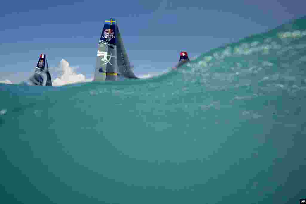 Boats from France, Sweden and Switzerland race during a qualifier match for the Red Bull Youth America's Cup, in the Great Sound of Bermuda. America's Cup match racing begins Saturday.