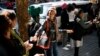 Volunteers participate in a human chain in Johannesburg, South Africa, to deliver food and clothes to a local charity as part of the 67 minutes events marking former South African President Nelson Mandela's 95th birthday, July 18, 2013. 
