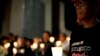 Activists and supporters of the Right2Know Campaign hold a night vigil outside the Constitutional Court in Johannesburg, Sept. 19, 2011.