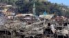 FILE - Damaged buildings are seen inside a war-torn area in Marawi City, southern Philippines, Oct. 24, 2017, after the Philippines announced on Monday the end of five months of military operations in a southern city held by pro-Islamic State rebels. 