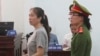 Prominent blogger Nguyen Ngoc Nhu Quynh, left, stands trial in the south central province of Khanh Hoa, Vietnam, June 29, 2017. She was accused of distorting government policies and defaming the Communist regime on her Facebook posts.