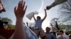FILE - An unidentified man celebrates his victory during International Pillow Fight Day in DuPont Circle in Washington, D.C., April 3, 2010. 