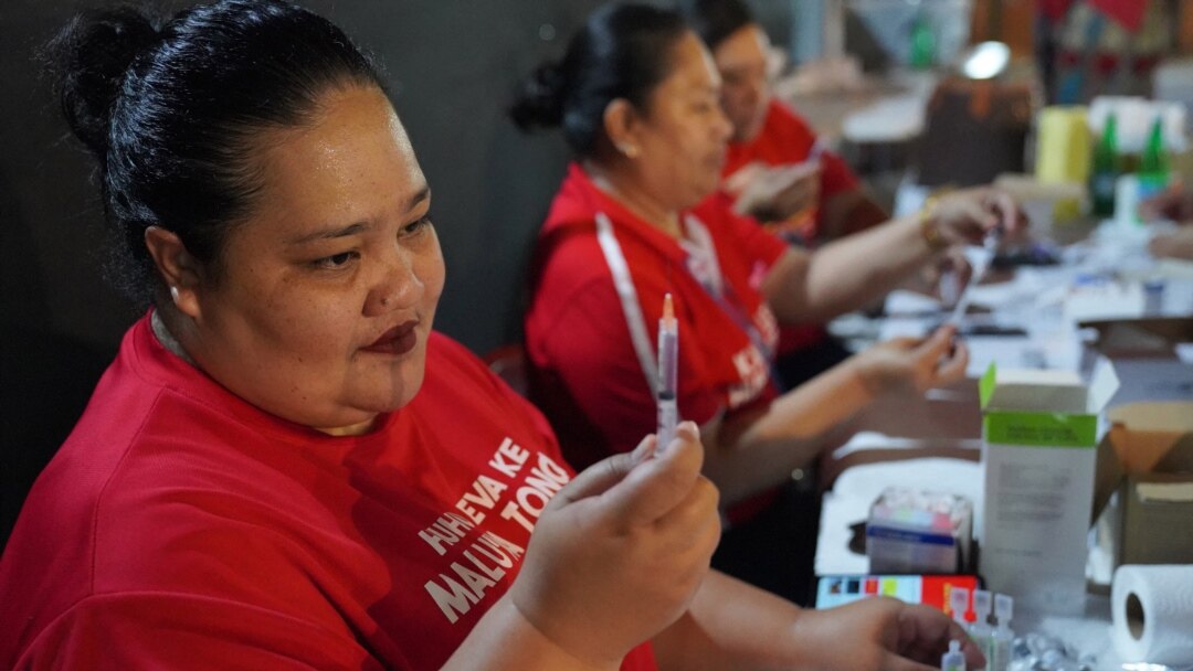A photo taken and released by Matangi Tonga on Oct. 30, 2021, shows a Tongan nurse preparing to vaccinate people against COVID-19 inside Queen Salote Memorial Hall in Nuku'alofa. (Photo by Eleanor Gee)