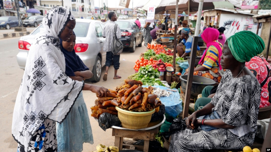 Idowu Bello, 56, shops for groceries in Ibadan, Nigeria, Sept. 13, 2024.