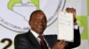 President-elect Uhuru Kenyatta displays the certificate from Independent Electoral and Boundaries Commission (IEBC) declaring him the winner of the country's presidential election in Nairobi, Mar. 9, 2013. 