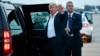 U.S. President Donald Trump yells to reporters after arriving at Andrews Air Force Base after a summit with North Korean leader Kim Jong Un in Singapore, June 13, 2018, in Andrews Air Force Base, Md. 