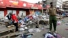 A policeman secures the scene of twin explosions at the Gikomba open-air market for second-hand clothes in Kenya's capital Nairobi, May 16, 2014.