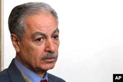 Mustafa al-Hiti, the head of the Iraq's reconstruction fund for areas affected by terroristic operations, speaks to The Associated Press in Kuwait City, Kuwait, Feb. 12, 2018.
