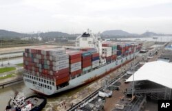 A Panamax cargo vessel navigates the new Cocoli locks during a test of the expanded Panama Canal locks on Pacific side, June 23, 2016. The ship, the largest that can go through the old canal locks, was redirected to the new ones for one more test of the new lock system.