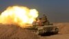Members of the Iraqi Army fire towards Islamic State militant positions at the south of Mosul, Iraq, Dec. 10, 2016. 
