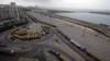 Fuel tankers, used to carry fuel for NATO forces in Afghanistan, are seen parked along a roadside near Karachi's Clifton Beach, July 4, 2012.