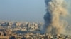Smoke rises as seen from a rebel-held area of Aleppo, Syria, Dec. 12, 2016. 