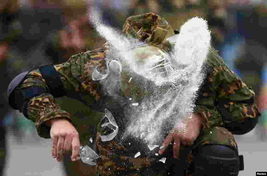 Belarusian paratroopers perform during the celebration of the Day of the Paratrooper, in Minsk, Belarus, July 29, 2017.