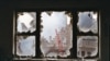 Ground zero seen through shattered window of 18th floor apartment overlooking the World Trade Center site, Sept. 20, 2001 file photo.