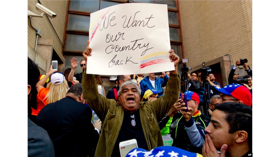 Opposition leader Juan Guaido supporters celebrate during the eviction and arrest of Nicolas Maduro's supporters from the Venezuelan Embassy in Washington, May 16, 2019.