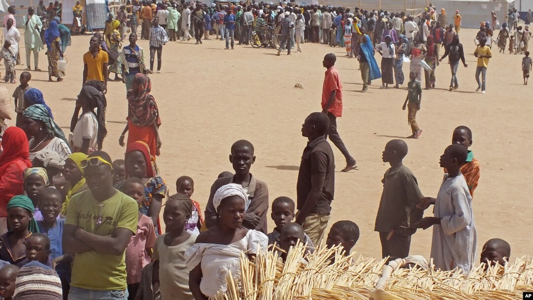 FILE - People who fled their homes due to violence from the militant group Boko Haram are seen inside a refugee camp in Minawao, Cameroon, Feb. 25, 2015.