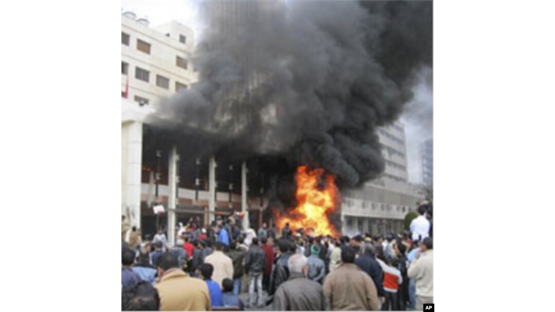 The local government headquarters is set on fire by protesters, claiming delays on requests for housing in Port Said, Egypt, February 10, 2011