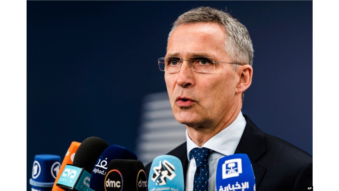 NATO Secretary-General Jens Stoltenberg talks with journalists as he arrives for a meeting of EU foreign and defense ministers at the Europa building in Brussels, May 18, 2017.