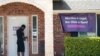 A security guard opens the door to the Whole Women's Health Clinic in Fort Worth, Texas, Sept. 1, 2021.