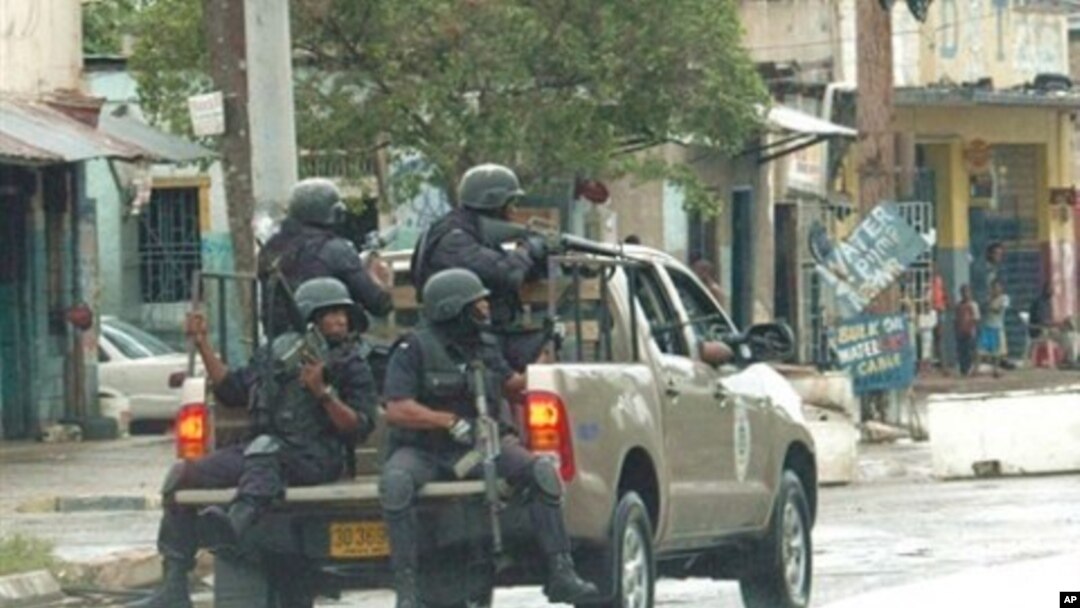 Police patrol sections of downtown Kingston, Jamaica, 24 May 2010