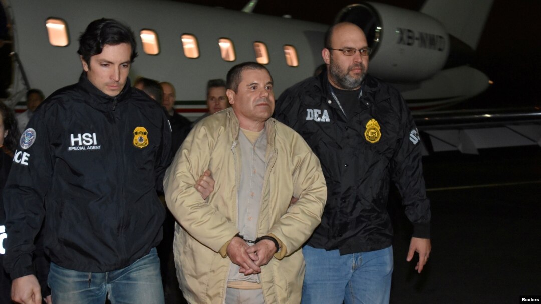 Mexico's top drug lord Joaquin 'El Chapo' Guzman is escorted as he arrives at Long Island MacArthur airport in New York, Jan. 19, 2017, after his extradition from Mexico. 