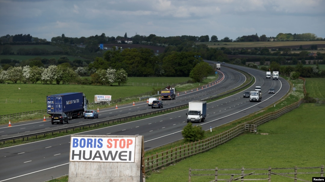A sign reading "Boris Stop Huawei" is seen next to the M40 motorway, Tetsworth, Britain, May 1, 2020. 