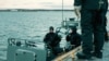 Navy divers of the Latvian Armed Forces take part in NATO exercise Freezing Winds 24, led by the Finnish Navy, in the Gulf of Finland, the Baltic Sea, Finland, November 23, 2024. Finnish Defence Forces/Handout via REUTERS 