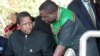FILE - Then-acting President Edgar Lungu (l) talks to foreign affairs minister Harry Kalaba during a military exhibition march, Oct. 24, 2014 to mark Zambia's 50th Independence celebration. 