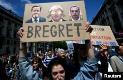 FILE - People hold banners during a 'March for Europe' demonstration against Britain's decision to leave the European Union, in central London, Britain, July 2, 2016.