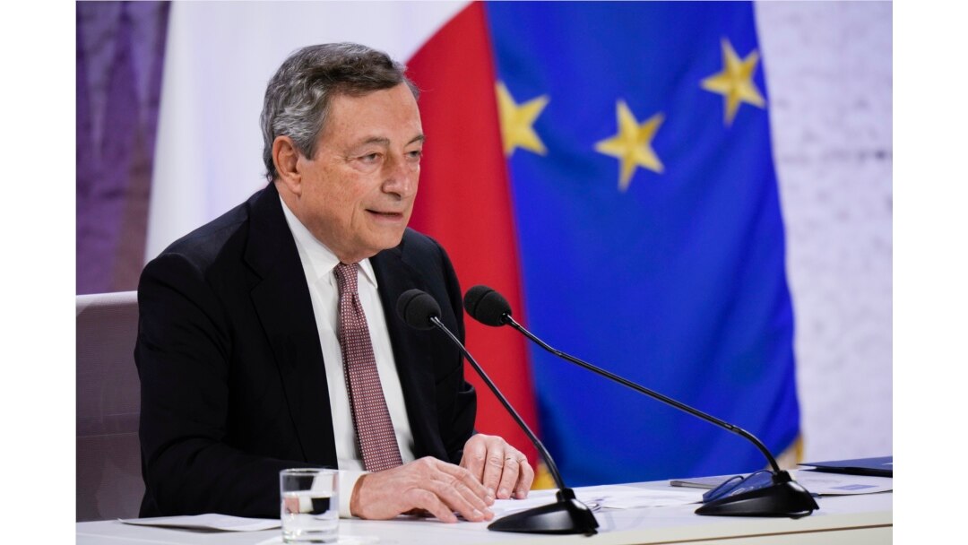 Italy's Prime Minister Mario Draghi reads statement during a press conference at the La Nuvola conference center for the G20 summit in Rome, Oct. 31, 2021.