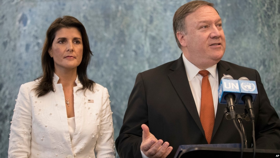 FILE - Former U.S. Secretary of State Mike Pompeo, right, with former U.S. Ambassador to the United Nations Nikki Haley, left, speaks at UN headquarters, July 20, 2018. Donald Trump said the two, who served in his first administration, will not serve in his second administration.