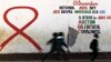 Children run past a mural painting of an Aids ribbon at a school in Khutsong Township, 74 km (46 miles) west of Johannesburg, August 22, 2011. 