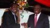 Zimbabwe President Robert Mugabe jokes with Prime Minister Morgan Tsvangirai, Harare, May 22, 2013.