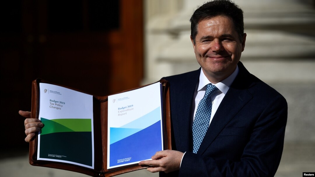 Ireland's Minister for Finance Paschal Donohoe displays a copy of the 2019 budget on the steps of Government Buildings in Dublin, Ireland Oct. 9, 2018.