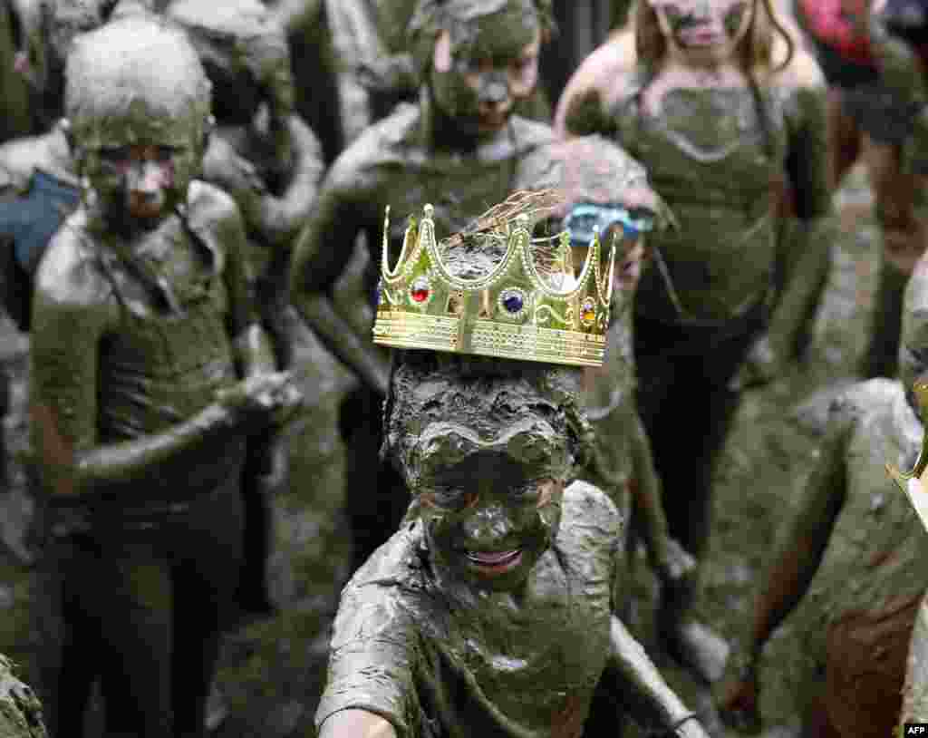 Mackenna Kofahl, 12, of Redford is crowned Mud Day Queen as part of Wayne County's annual Mud Day at Nankin Mills Park in Westland, Michigan.