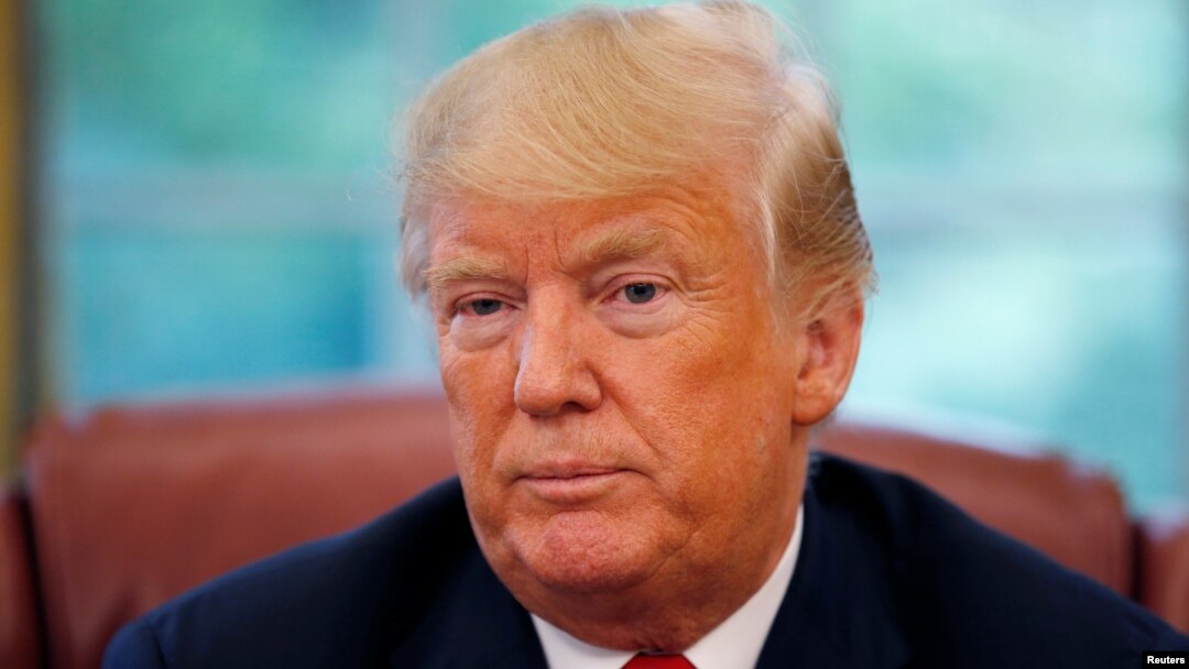 U.S. President Donald Trump listens to a question during an interview with Reuters in the Oval Office of the White House in Washington, Aug. 20, 2018. 