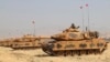 Turkey's Armed Forces soldiers in tanks take part in a military drill near the town of Silopi, Turkey, close to the Habur border gate between Turkey and the autonomous Kurdish region in Iraq, Sept. 18, 2017.