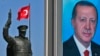 A statue of modern Turkey's founder, Mustafa Kemal Ataturk, and a poster of Turkish President Recep Tayyip Erdogan are seen in his hometown city of Rize ahead of an upcoming referendum, April 4, 2017.