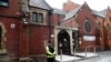 A police officer stands outside Didsbury mosque in Manchester, Britain, May 24, 2017. 