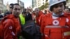 Lebanese Red Cross workers carry body from scene of explosion that killed several people, including Mohammed Chatah, senior aide to former Prime Minister Saad Hariri, Beirut, Dec. 27, 2013.