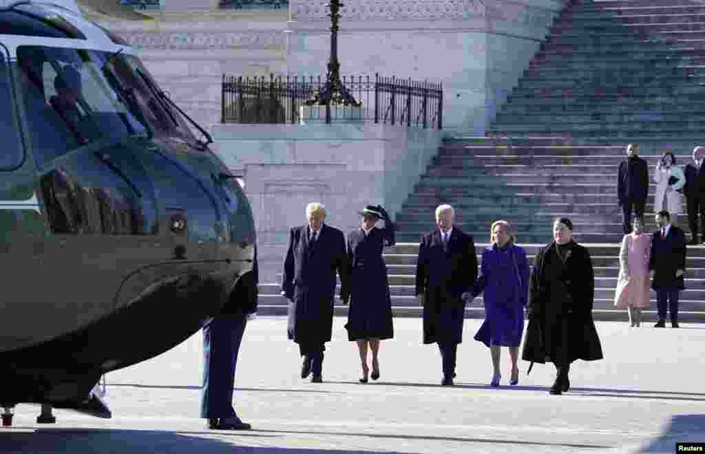 President Donald Trump and first lady Melania Trump walk from the U.S. Capitol building with Former President Joe Biden and Former first lady Jill Biden as they board Marine One on the inauguration day in Washington, Jan. 20, 2025.