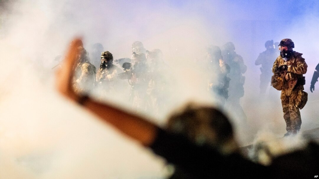 Federal officers use chemical irritants and projectiles to disperse Black Lives Matter protesters at the Mark O. Hatfield United States Courthouse in Portland, Oregon, July 24, 2020.
