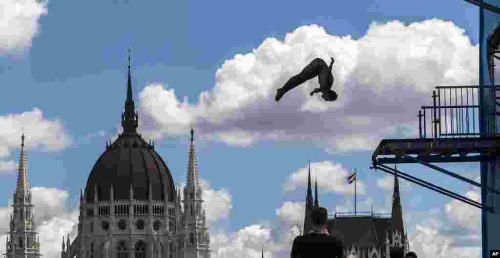A diver practices at the Swimming World Championships at the Batthyany square in Budapest, Hungary.