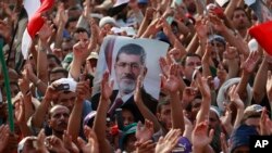 Supporters of ousted President Mohammed Morsi protest in Nasr City, Cairo, Egypt, July 9, 2013. 