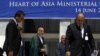 Afghan President Hamid Karzai (C) arrives for a group photo with ministers from other Heart of Asia member countries at the end of a conference in Kabul June 14, 2012.