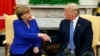 President Donald Trump meets with German Chancellor Angela Merkel in the Oval Office of the White House, April 27, 2018, in Washington. 
