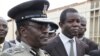 Kenyan Commissioner of Police Mathew Kirai Iteere, left, talk s to media in Nairobi, Kenya, Nov. 13, 2012.