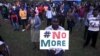 People sing as they attend a memorial concert in Kenya's capital Nairobi, April 14, 2015, in memory of the victims of the deadly Garissa University College attack in early April.