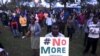 People sing as they attend a memorial concert at the "Freedom Corner" in Kenya's capital Nairobi, April 14, 2015, in memory of the Garissa university students who were killed by gunmen.